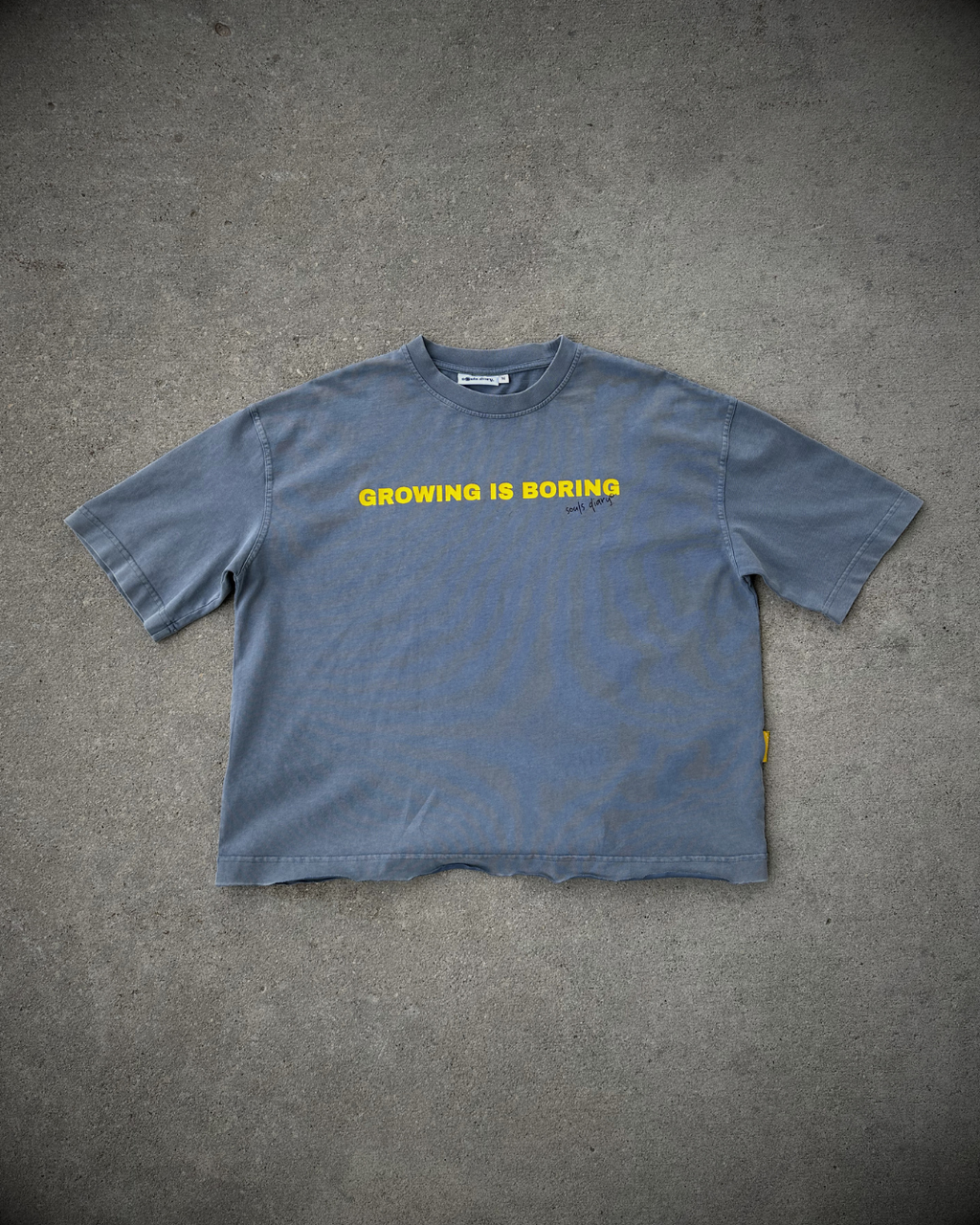 "boring" tee in stone blue