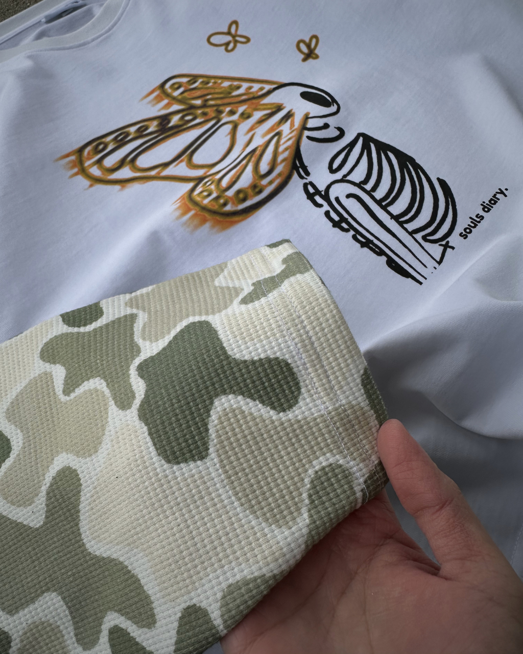 "metamorphosis" camo tee