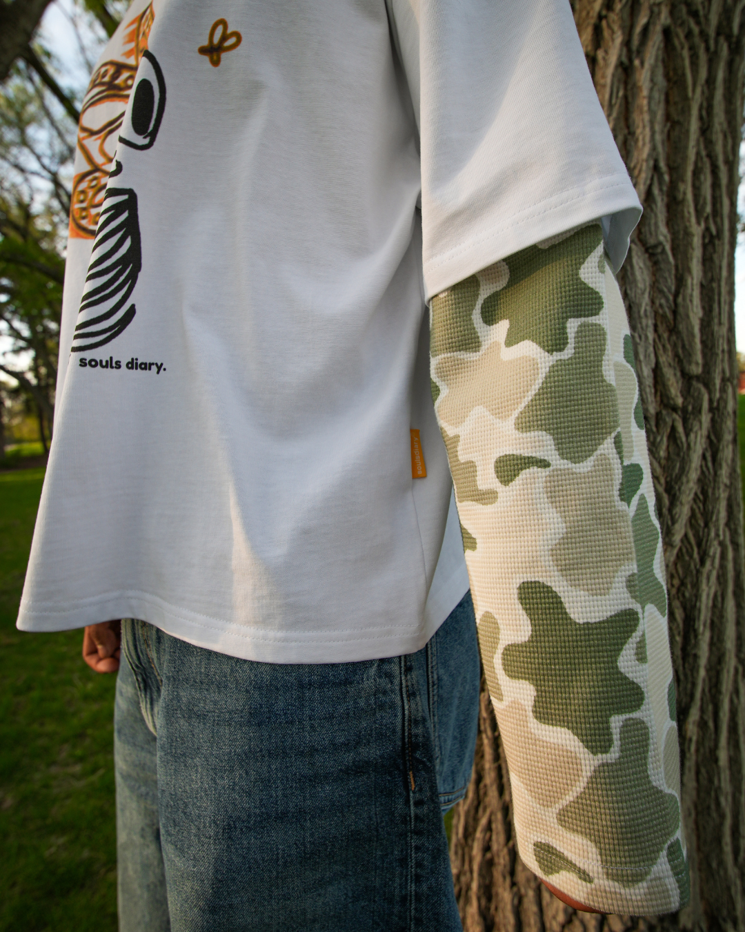 "metamorphosis" camo tee